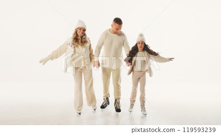 Family enjoys time on ice rink, smiling and holding hands, capturing joy of spending quality time together during winter season against white background. Family enjoys time on ice rink, smiling and holding hands, capturing joy of spending quality time together during winter season against white background. 119593239