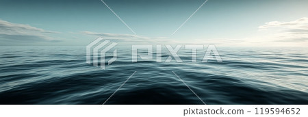Serene view of calm ocean waters under a bright sky at dawn with subtle waves reflecting sunlight 119594652