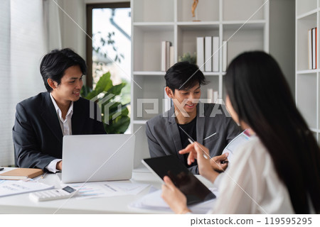 Business Team Meeting in Modern Conference Room Discussing Ideas and Strategies 119595295