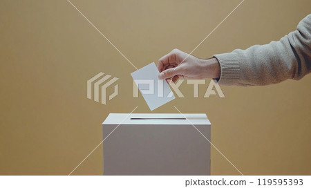 Hand putting a ballot into a ballot box 119595393