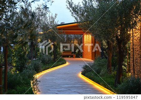 A tranquil evening stroll through a beautifully landscaped park with illuminated pathways 119595847