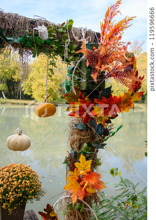Autumn Halloween pumpkin decorations in a park background Autumn Halloween pumpkin decorations in a park background 119596666