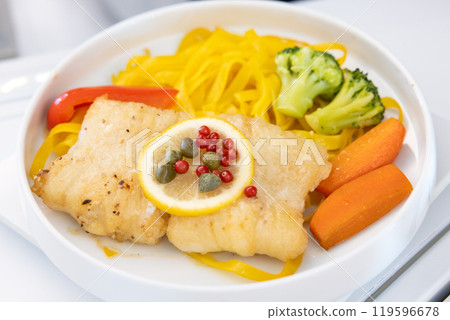 Delicious Business Class meal: sole fillet with citrus Delicious Business Class meal: sole fillet with citrus 119596678
