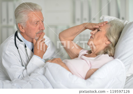 An elderly woman in the hospital with a doctor 119597126