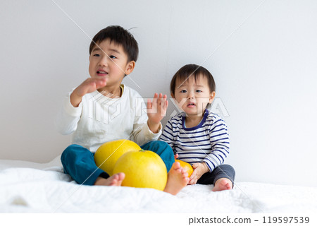 Brothers with fruits 119597539