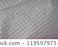 Recycled perforated white paper close up texture 119597973