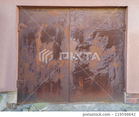 Rusted metal door with weathered texture 119598642