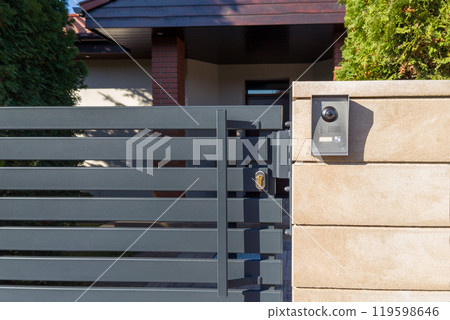 Modern gate with security intercom system Modern gate with security intercom system 119598646