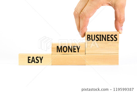 Easy money business symbol. Concept words Easy money business on beautiful wooden blocks. Beautiful white table white background. Businessman hand. Easy money business concept. Copy space. 119599387