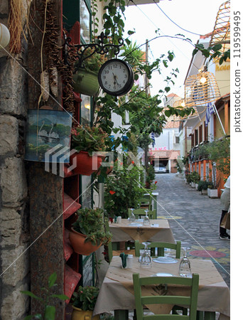 Pythagoreio, Samos, Greece - August 3 2024: traditional taverna on the old street  at Pythagoreio town, Samos Island 119599495