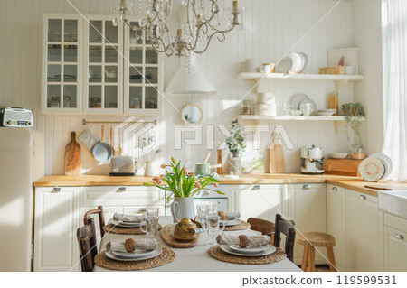 Scandinavian classic minimalistic kitchen with white and wooden details flowers. Modern white kitchen clean contemporary style interior design. Empty bright white interior minimal of kitchen Scandinavian classic minimalistic kitchen with white and wooden details flowers. Modern white kitchen clean contemporary style interior design. Empty bright white interior minimal of kitchen 119599531