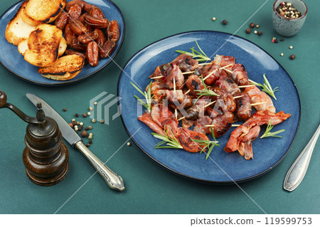 Crispy bacon wrapped dates. 119599753