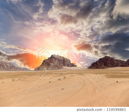 Wadi Rum Desert also known as The Valley of the Moon (against the sky with clouds)-- is a valley cut into the sandstone and granite rock in southern Jordan 60 km to the east of Aqaba Wadi Rum Desert also known as The Valley of the Moon (against the sky with clouds)-- is a valley cut into the sandstone and granite rock in southern Jordan 60 km to the east of Aqaba 119599861