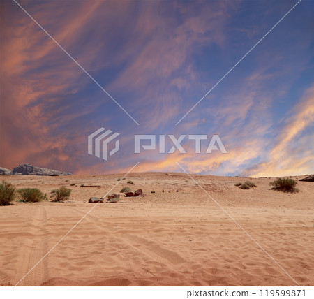 Wadi Rum Desert also known as The Valley of the Moon (against the sky with clouds)-- is a valley cut into the sandstone and granite rock in southern Jordan 60 km to the east of Aqaba Wadi Rum Desert also known as The Valley of the Moon (against the sky with clouds)-- is a valley cut into the sandstone and granite rock in southern Jordan 60 km to the east of Aqaba 119599871