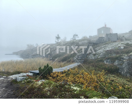 Foggy morning at Volosyanaya mountain, Kandalaksha, showcasing unique landscape and tranquility. Path to Dubldom cabin 119599908