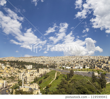 Amman city landmarks-- old roman Citadel Hill, Jordan. Against the background of a beautiful sky with clouds 119599941