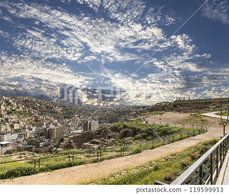 Amman city landmarks-- old roman Citadel Hill, Jordan. Against the background of a beautiful sky with clouds 119599953