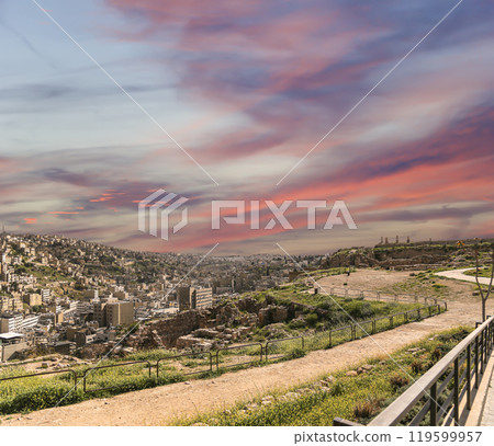 Amman city landmarks-- old roman Citadel Hill, Jordan. Against the background of a beautiful sky with clouds Amman city landmarks-- old roman Citadel Hill, Jordan. Against the background of a beautiful sky with clouds 119599957