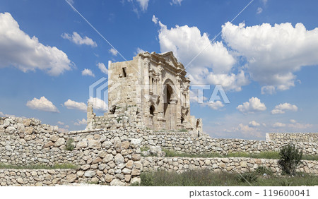 Arch of Hadrian in Gerasa (Jerash)-- was built to honor the visit of emperor Hadrian to Jerash in 129/130 AD, Jordan. Against the background of a beautiful sky with clouds 119600041