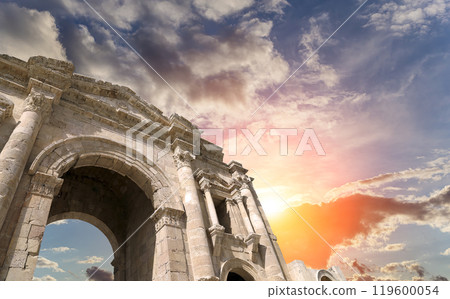 Arch of Hadrian in Gerasa (Jerash)-- was built to honor the visit of emperor Hadrian to Jerash in 129/130 AD, Jordan. Against the background of a beautiful sky with clouds 119600054