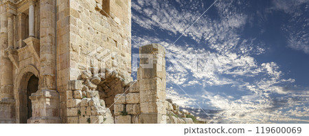 Arch of Hadrian in Gerasa (Jerash)-- was built to honor the visit of emperor Hadrian to Jerash in 129/130 AD, Jordan. Against the background of a beautiful sky with clouds Arch of Hadrian in Gerasa (Jerash)-- was built to honor the visit of emperor Hadrian to Jerash in 129/130 AD, Jordan. Against the background of a beautiful sky with clouds 119600069