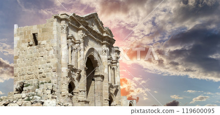 Arch of Hadrian in Gerasa (Jerash)-- was built to honor the visit of emperor Hadrian to Jerash in 129/130 AD, Jordan. Against the background of a beautiful sky with clouds 119600095