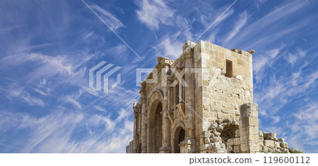 Arch of Hadrian in Gerasa (Jerash)-- was built to honor the visit of emperor Hadrian to Jerash in 129/130 AD, Jordan. Against the background of a beautiful sky with clouds 119600112