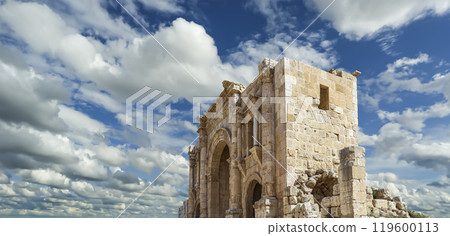 Arch of Hadrian in Gerasa (Jerash)-- was built to honor the visit of emperor Hadrian to Jerash in 129/130 AD, Jordan. Against the background of a beautiful sky with clouds 119600113