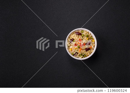 Boiled wheat bulgur porridge with vegetables peppers, peas, corn 119600324