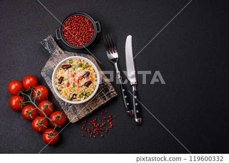 Boiled wheat bulgur porridge with vegetables peppers, peas, corn 119600332