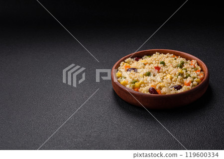 Boiled wheat bulgur porridge with vegetables peppers, peas, corn Boiled wheat bulgur porridge with vegetables peppers, peas, corn 119600334