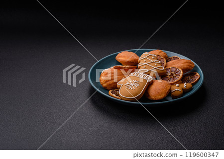 French classic madeleine sponge cake with elements of Christmas motifs 119600347