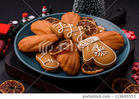 French classic madeleine sponge cake with elements of Christmas motifs French classic madeleine sponge cake with elements of Christmas motifs 119600353
