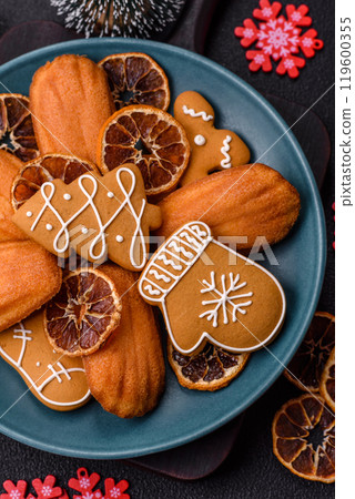 French classic madeleine sponge cake with elements of Christmas motifs 119600355