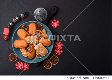 French classic madeleine sponge cake with elements of Christmas motifs French classic madeleine sponge cake with elements of Christmas motifs 119600357