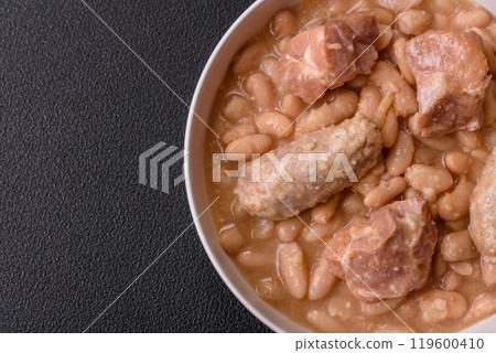 Cassoulet with white beans, meat and sausages, vegetables, salt and spices 119600410