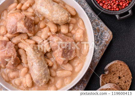 Cassoulet with white beans, meat and sausages, vegetables, salt and spices Cassoulet with white beans, meat and sausages, vegetables, salt and spices 119600413