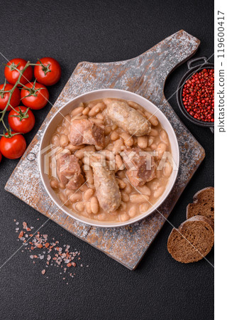 Cassoulet with white beans, meat and sausages, vegetables, salt and spices 119600417