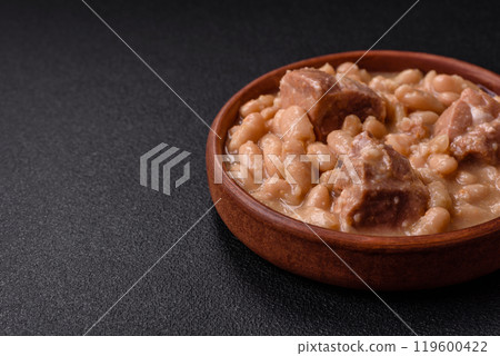 Cassoulet with white beans, meat and sausages, vegetables, salt and spices Cassoulet with white beans, meat and sausages, vegetables, salt and spices 119600422