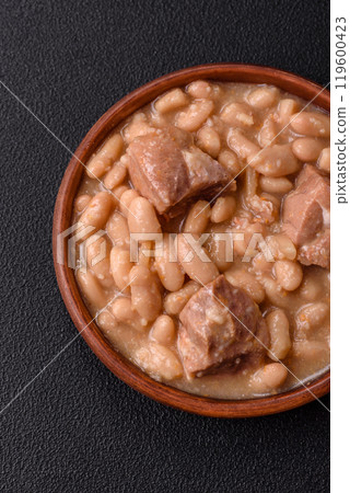 Cassoulet with white beans, meat and sausages, vegetables, salt and spices Cassoulet with white beans, meat and sausages, vegetables, salt and spices 119600423
