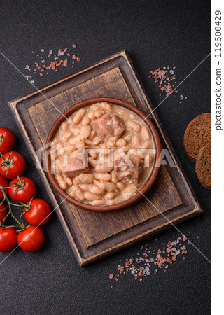 Cassoulet with white beans, meat and sausages, vegetables, salt and spices Cassoulet with white beans, meat and sausages, vegetables, salt and spices 119600429