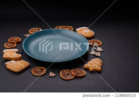 Empty round ceramic copy space plate with gingerbread cookies and Christmas elements Empty round ceramic copy space plate with gingerbread cookies and Christmas elements 119600510