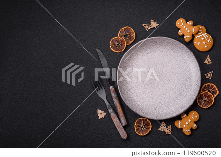 Empty round ceramic copy space plate with gingerbread cookies and Christmas elements 119600520