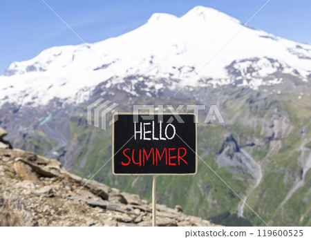 Hello summer symbol. Concept words Hello summer on beautiful yellow blackboard. Beautiful mountain Elbrus background. Business lifestyle Hello summer concept. Copy space. 119600525
