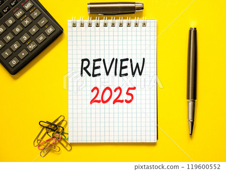 Planning review 2025 new year symbol. Concept words Review 2025 on beautiful white note. Beautiful yellow paper background. Black calculator. Business review 2025 new year concept. Copy space. Planning review 2025 new year symbol. Concept words Review 2025 on beautiful white note. Beautiful yellow paper background. Black calculator. Business review 2025 new year concept. Copy space. 119600552