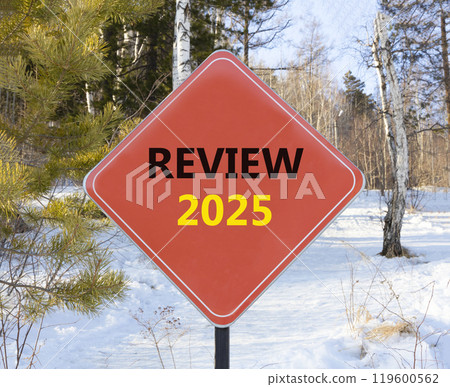 Planning review 2025 new year symbol. Concept words Review 2025 on beautiful red road sign. Beautiful winter forest background. Business review 2025 new year concept. Copy space. 119600562