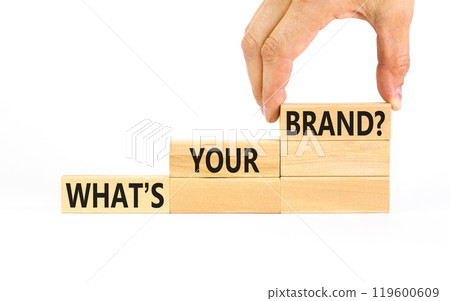 Branding and what is your brand symbol. Concept words What is your brand on beautiful blocks. Beautiful white background. Businessman hand. Business branding what is your brand concept. Copy space. 119600609