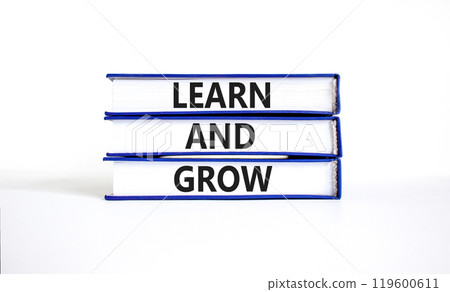 Learn and grow symbol. Concept word Learn And Grow on beautiful books. Beautiful white table white background. Business, education learn and grow concept. Copy space. 119600611