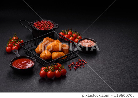 Breaded camembert or brie cheese baked in the form of nuggets with salt and spices 119600703