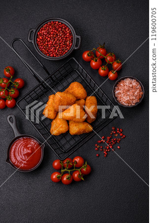 Breaded camembert or brie cheese baked in the form of nuggets with salt and spices 119600705